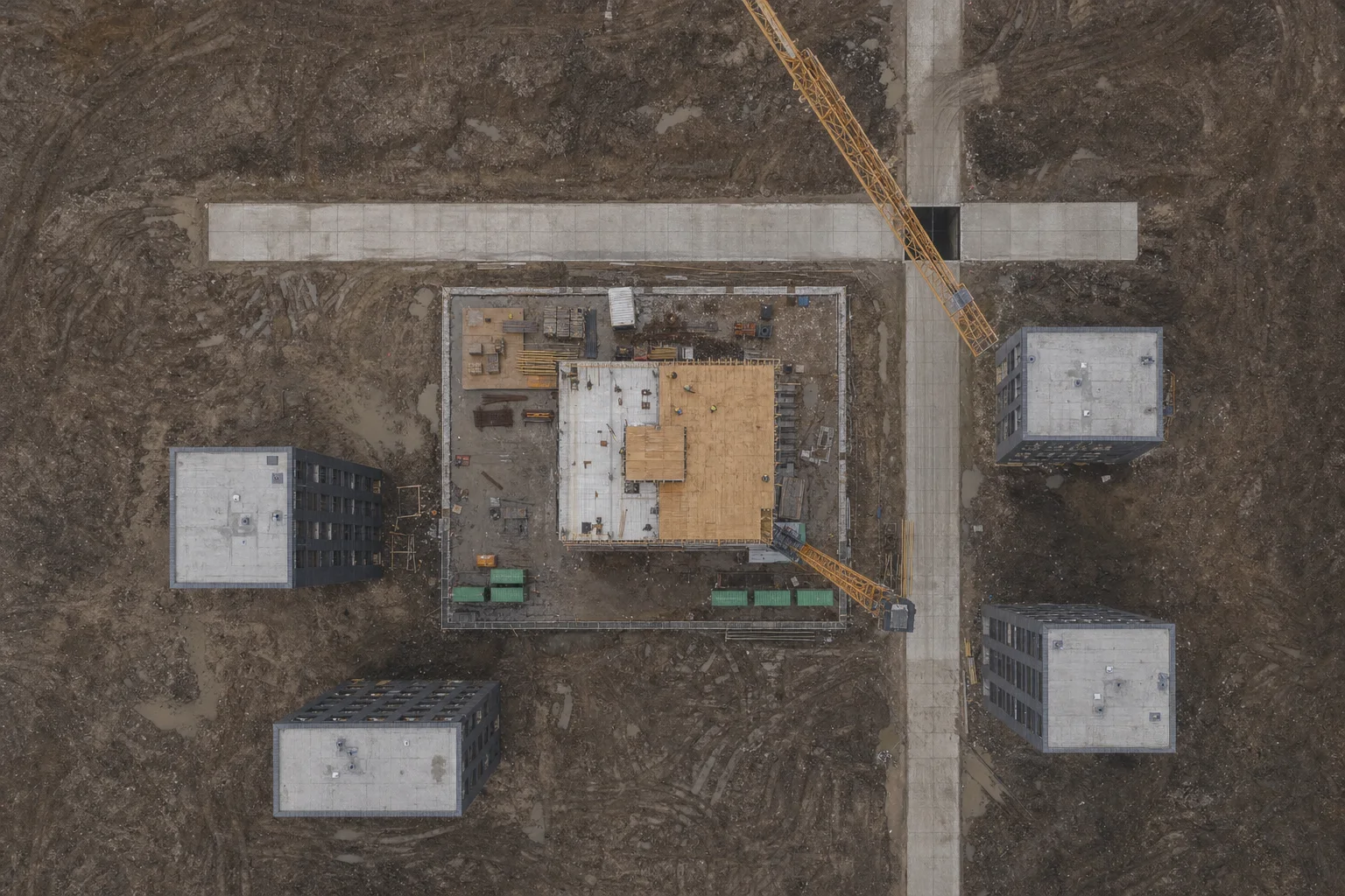 Top-down drone photo of the demo tower site in July (AI-generated sample image)