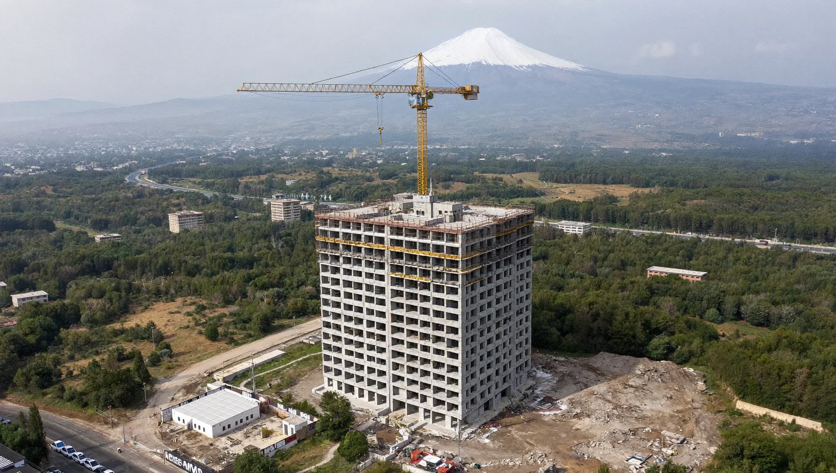 Aerial drone photo of a residential tower under construction (AI-generated sample image)